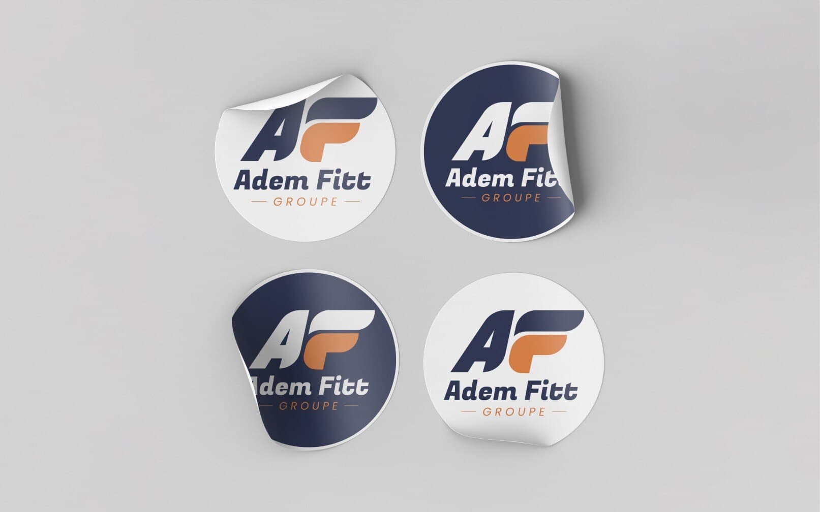 Round Adem Fitt stickers in navy and white